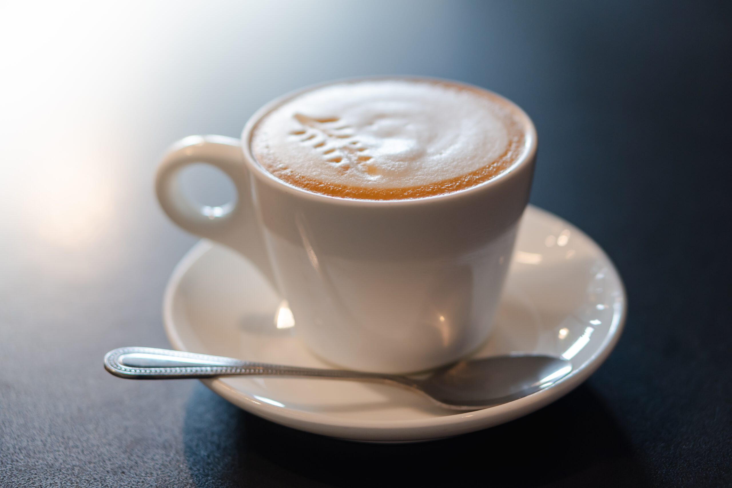 cappuccino-coffee-on-black-background-2022-11-09-15-17-49-utc